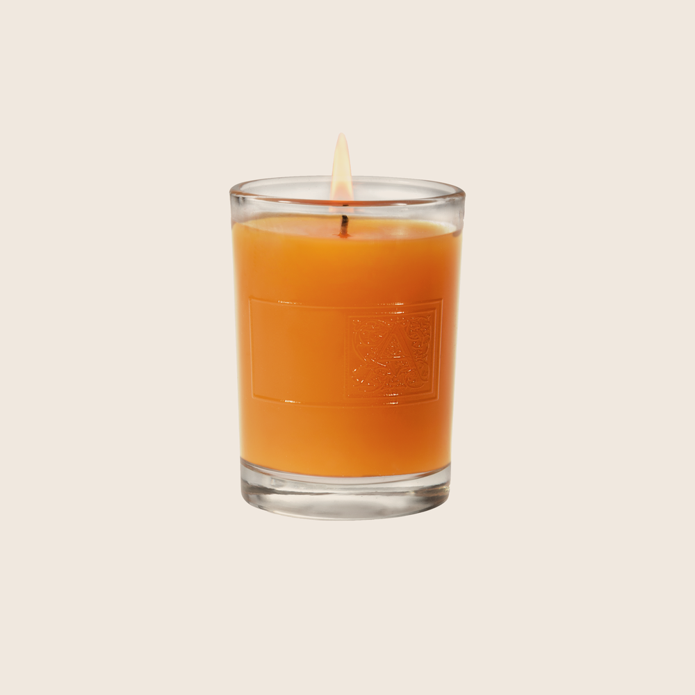 The Valencia Orange Votive Candle transforms a room with the fragrance of sweet oranges mixed with notes of apples and red berries with a hint of citrus peel. Our candles are all hand-poured in Arkansas. Made with a proprietary wax blend, ethically sourced containers and cotton wicks. Light one of these aromatic candles and transport yourself to a memory or emotion.