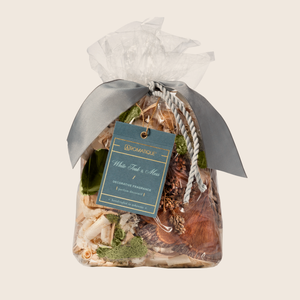 White Teak & Moss Decorative Fragrance is the ideal fragrance in any space. The Standard Bag is our iconic Decorative Fragrance style. Using bleached bark, palm petals, and reindeer moss, this decorative fragrance adds a bright, cheery touch to any space. White Teak & Moss instantly refreshes a room with a clean fragrance of fresh citrus over notes of earthy moss, coconut, and sandalwood.